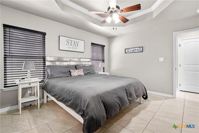 2319 Westview Dr, Canyon Lake, TX 78133 - bedroom with tile patterned floors, baseboards, a tray ceiling, and crown molding