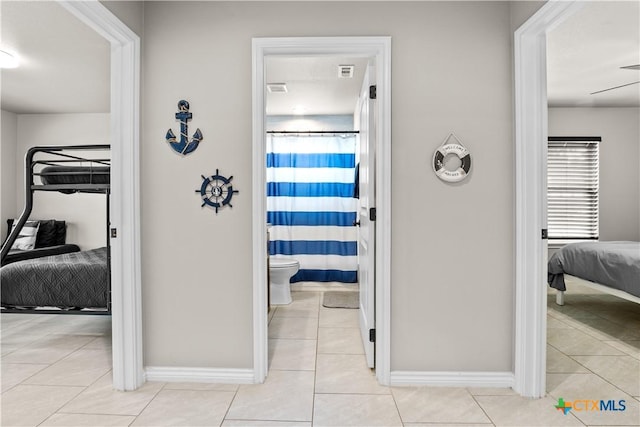 2319 Westview Dr, Canyon Lake, TX 78133 - hallway with visible vents, tile patterned flooring, and baseboards