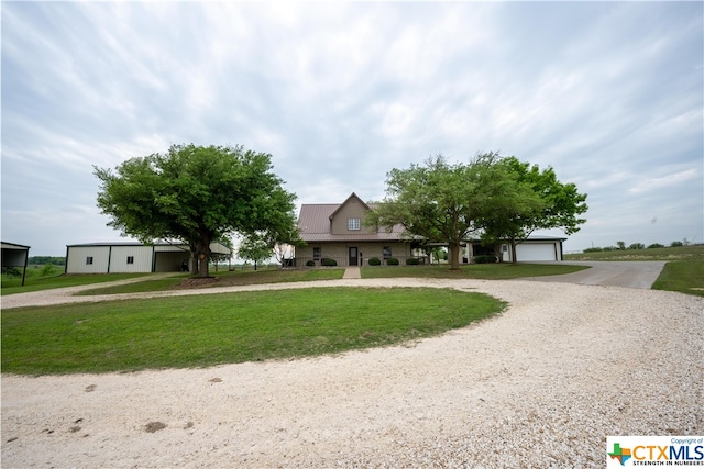 view of front of home featuring a garage and a front yard