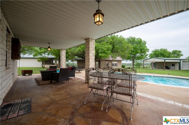 view of patio / terrace featuring a fenced in pool and an outdoor living space