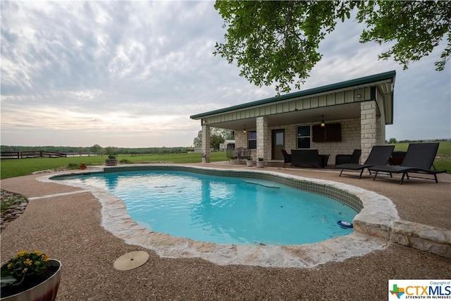 view of pool featuring a patio area