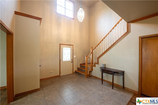 entryway featuring a high ceiling