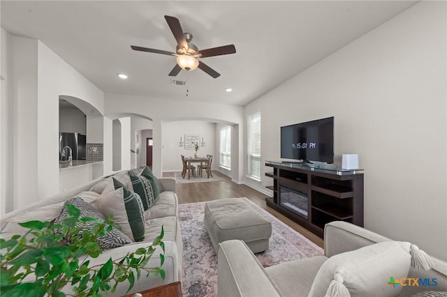 1044 Shelby Dr, Belton, TX 76513 - living room featuring visible vents, recessed lighting, wood finished floors, arched walkways, and a ceiling fan