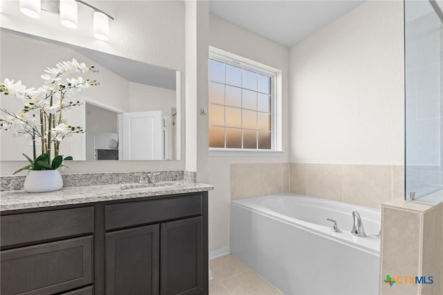 1044 Shelby Dr, Belton, TX 76513 - full bathroom featuring vanity, a bath, and tile patterned flooring