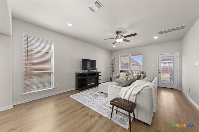 1044 Shelby Dr, Belton, TX 76513 - living room featuring baseboards, wood finished floors, visible vents, and ceiling fan