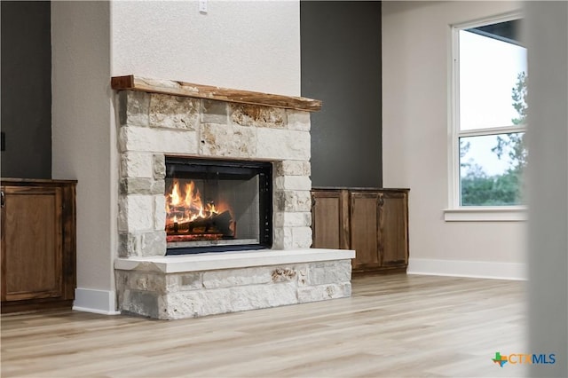 interior details featuring a fireplace and hardwood / wood-style floors