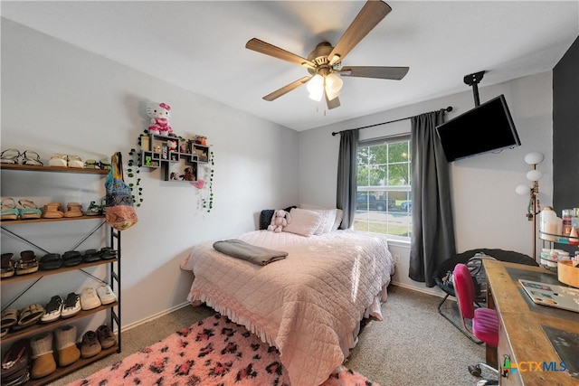 bedroom featuring baseboards, carpet flooring, and ceiling fan