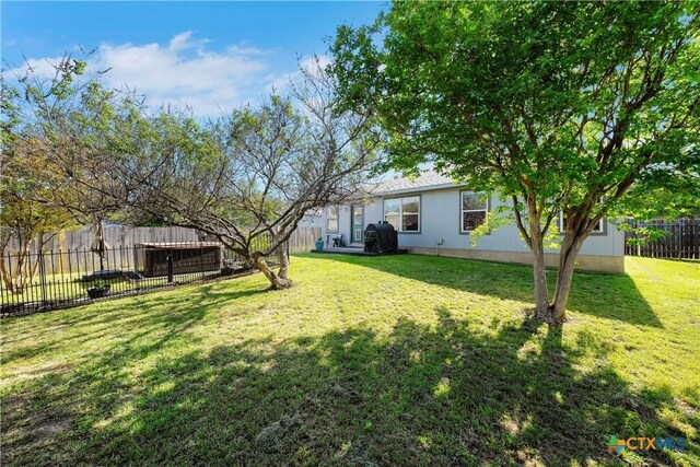 view of yard with a fenced backyard