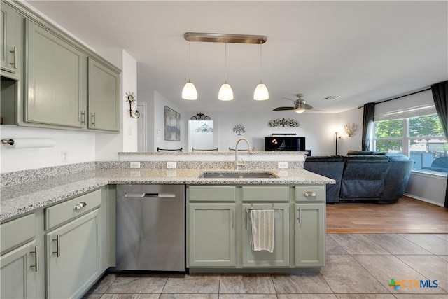 kitchen featuring a sink, open floor plan, a ceiling fan, a peninsula, and stainless steel dishwasher