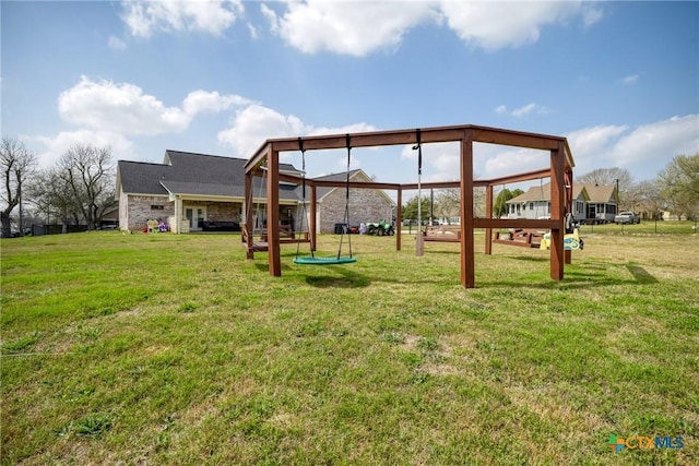 view of play area featuring a gazebo and a lawn