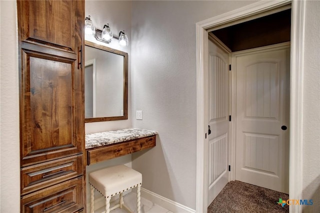 bathroom featuring baseboards