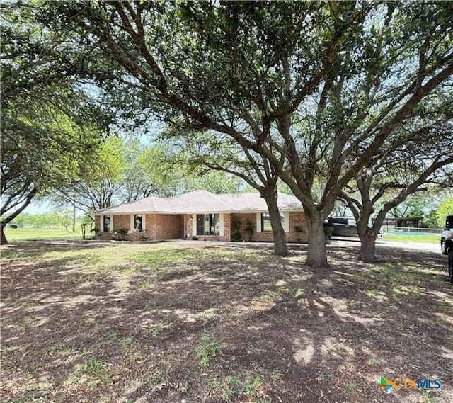 6601 Wells Fargo Rd, Killeen, TX 76542 - ranch-style home featuring a carport and brick siding