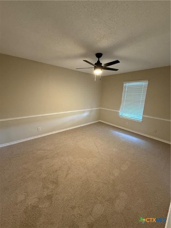 6601 Wells Fargo Rd, Killeen, TX 76542 - spare room with ceiling fan, dark colored carpet, a textured ceiling, and baseboards