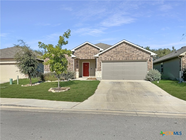 ranch-style home featuring a garage and a front yard