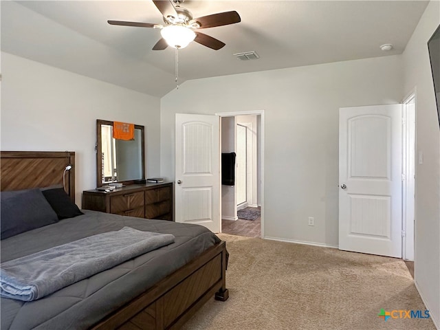 carpeted bedroom featuring ceiling fan and vaulted ceiling