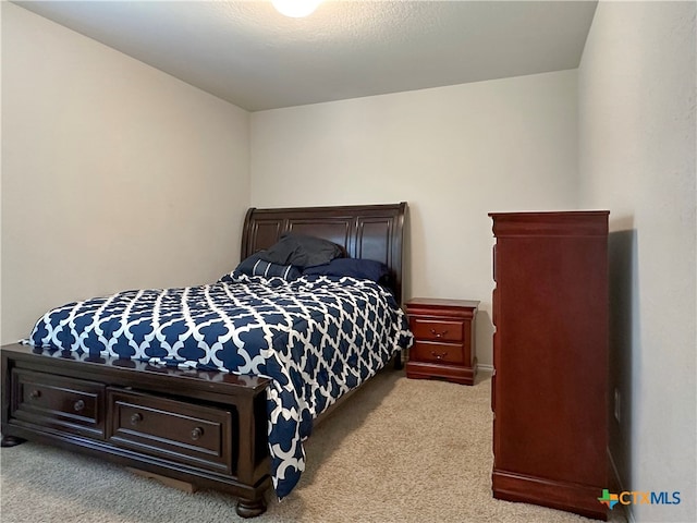 bedroom with light colored carpet