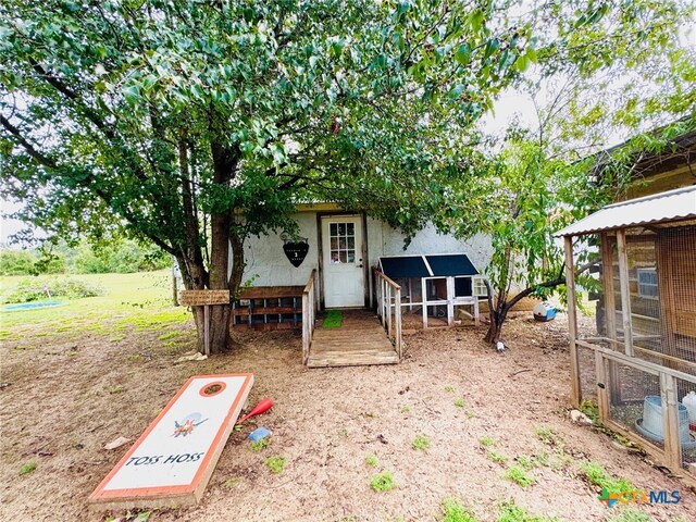 exterior space featuring an outbuilding