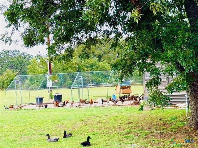 surrounding community featuring a playground and a lawn