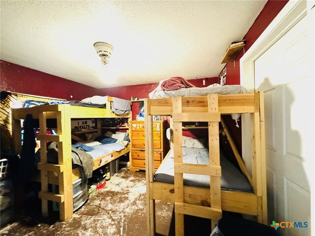 bedroom featuring a textured ceiling