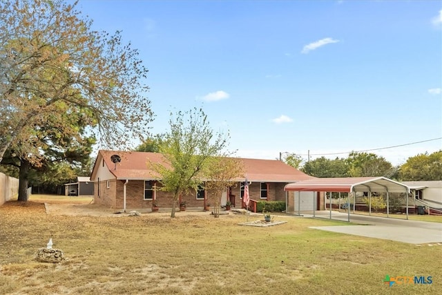 ranch-style home featuring a carport, concrete driveway, a front yard, and brick siding