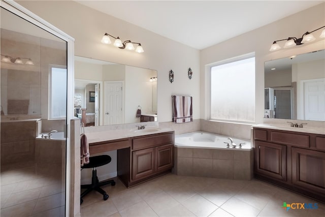 115 Scarlet Ct, Canyon Lake, TX 78133 - bathroom with a shower stall, a sink, two vanities, a bath, and tile patterned flooring