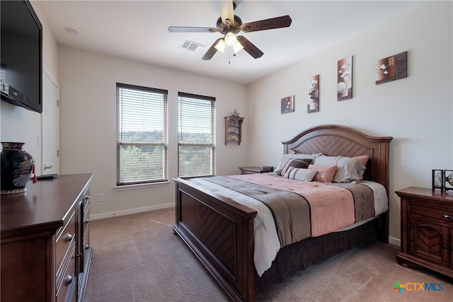 115 Scarlet Ct, Canyon Lake, TX 78133 - bedroom featuring visible vents, ceiling fan, light colored carpet, and baseboards