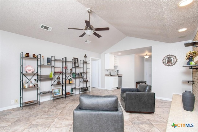 812 Trail Crest Dr, Harker Heights, TX 76548 - living room featuring ceiling fan, a textured ceiling, baseboards, vaulted ceiling, and visible vents