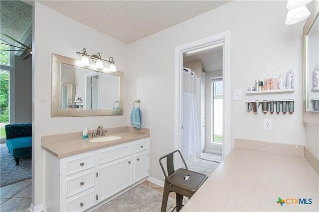 812 Trail Crest Dr, Harker Heights, TX 76548 - bathroom featuring vanity, ceiling fan, a textured ceiling, and a shower with shower curtain