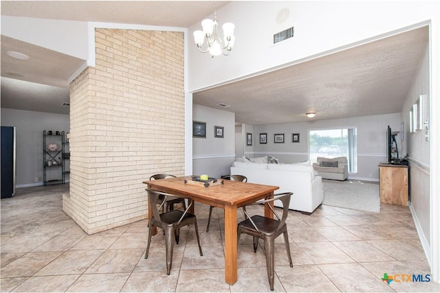 812 Trail Crest Dr, Harker Heights, TX 76548 - dining area with visible vents, a textured ceiling, a notable chandelier, and light tile patterned flooring