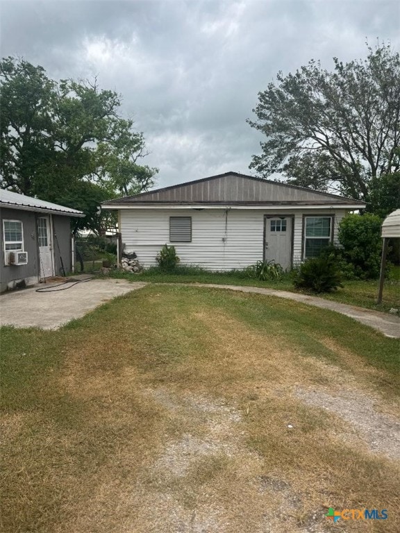 view of home's exterior with a yard