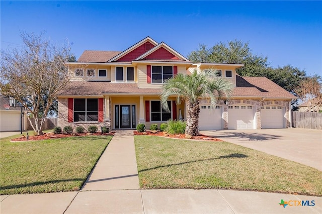 view of front of property featuring a front yard and a garage