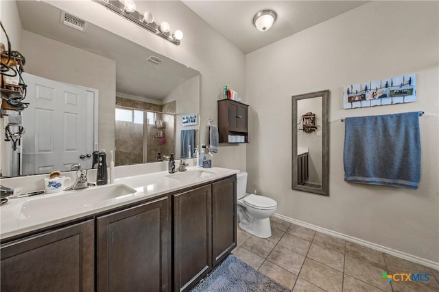 406 Coby, Troy, TX 76579 - bathroom with tiled shower, tile patterned floors, and double vanity