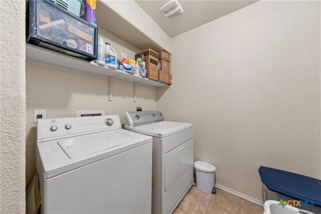 406 Coby, Troy, TX 76579 - laundry room featuring independent washer and dryer and light tile patterned floors