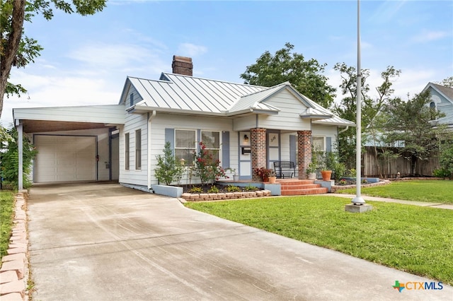 216 E Cedar St, Seguin, TX 78155 - view of front facade featuring a standing seam roof, a chimney, concrete driveway, metal roof, and brick siding