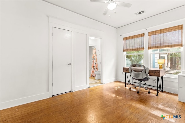 216 E Cedar St, Seguin, TX 78155 - office with ceiling fan, light wood-type flooring, and baseboards