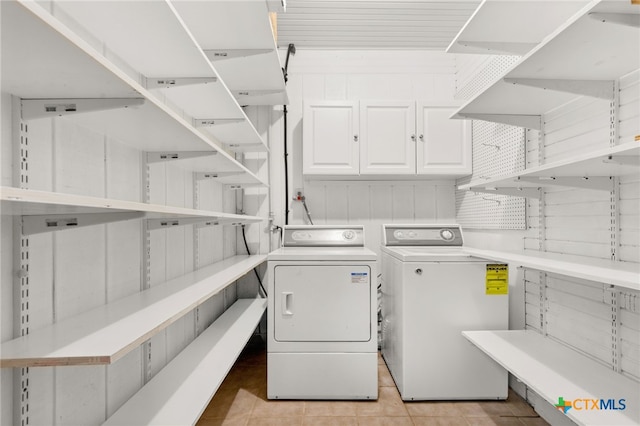 216 E Cedar St, Seguin, TX 78155 - laundry room with separate washer and dryer and light tile patterned flooring