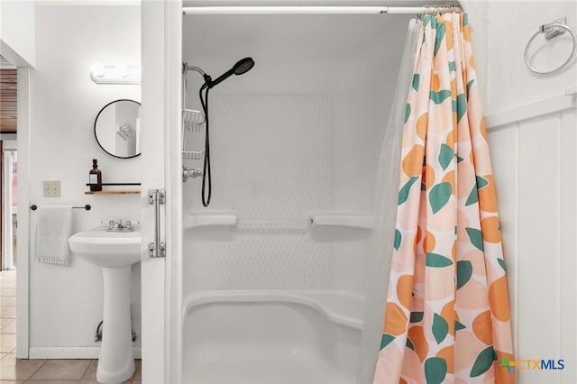 216 E Cedar St, Seguin, TX 78155 - full bath with tile patterned floors, curtained shower, and a sink