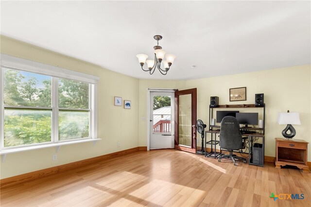 216 E Cedar St, Seguin, TX 78155 - office space with light wood finished floors, a chandelier, and baseboards