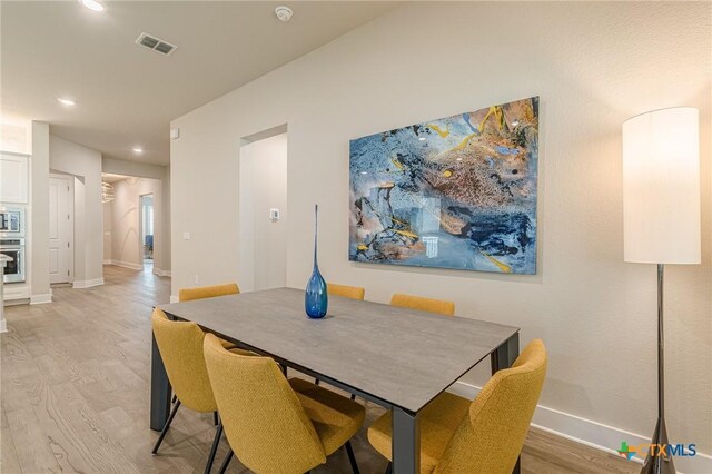 433 Skipping Cedar St, San Marcos, TX 78666 - dining space with light wood-type flooring, recessed lighting, and baseboards