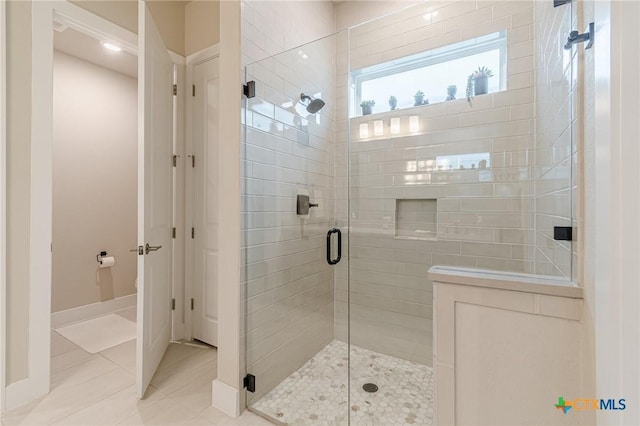 433 Skipping Cedar St, San Marcos, TX 78666 - bathroom featuring a shower stall, tile patterned floors, and baseboards