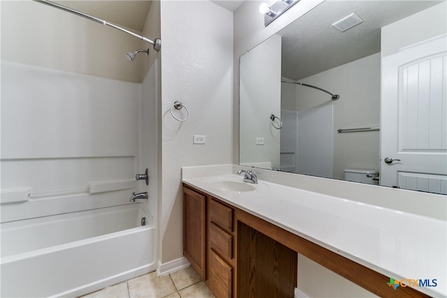 full bath featuring washtub / shower combination, vanity, toilet, and tile patterned floors