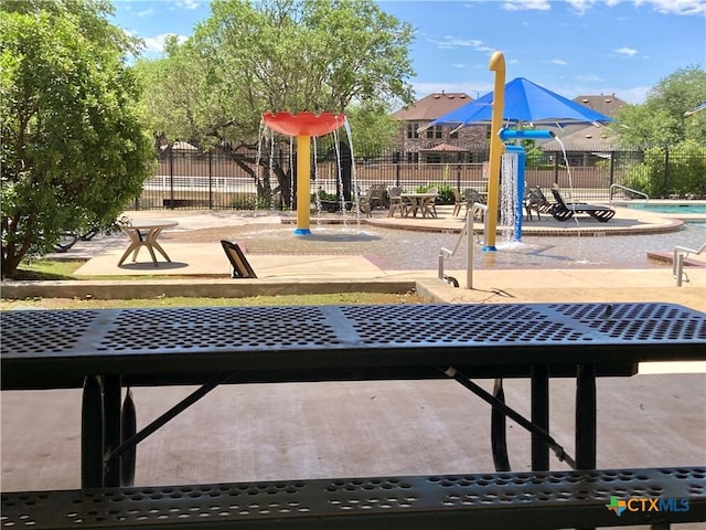 community play area featuring fence