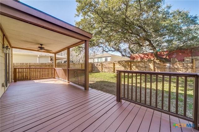 deck featuring a fenced backyard and a ceiling fan