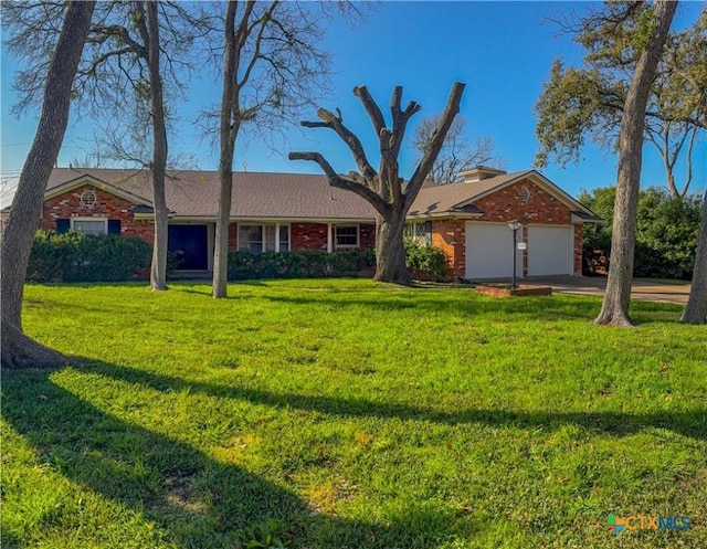 single story home featuring a front yard and a garage