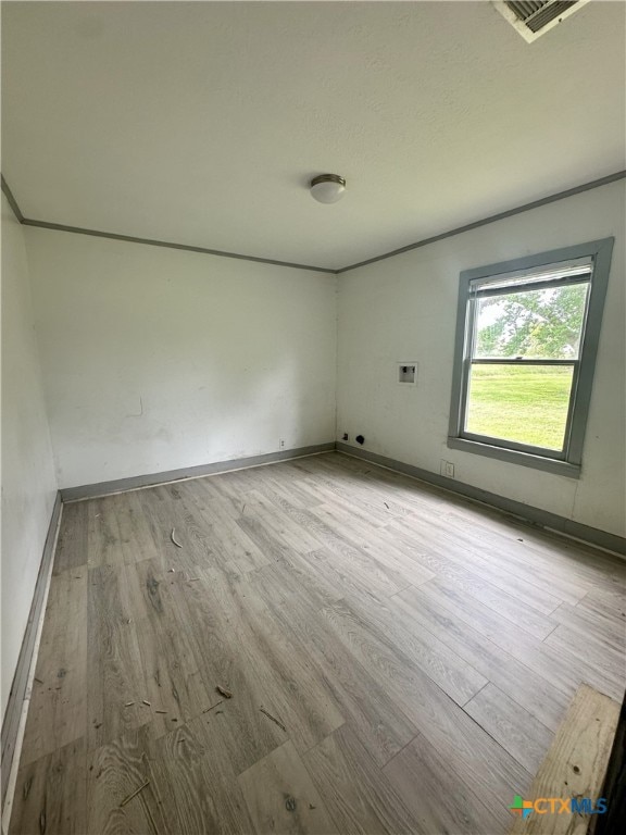 spare room with light wood-type flooring