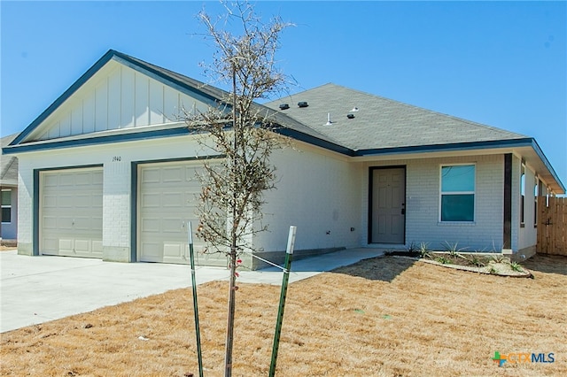 single story home featuring a garage