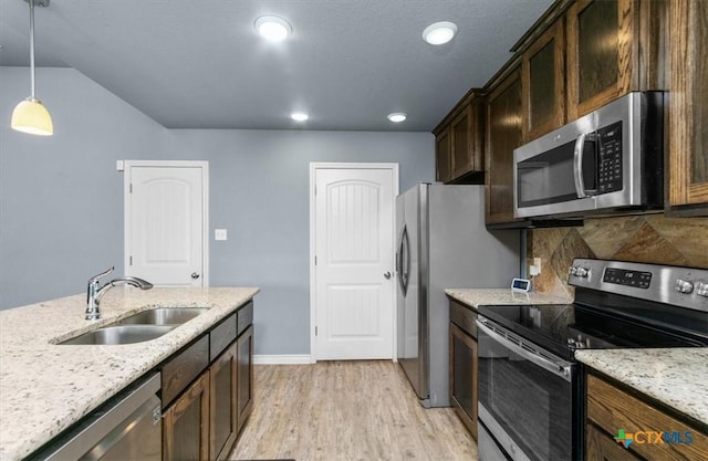 832 Paseo Del Plata, Temple, TX 76502 - kitchen featuring stainless steel appliances, light wood-type flooring, light stone counters, decorative light fixtures, and recessed lighting