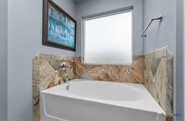 832 Paseo Del Plata, Temple, TX 76502 - full bathroom featuring a bath and a textured wall