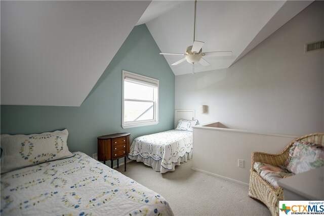 bedroom with lofted ceiling, ceiling fan, and carpet floors