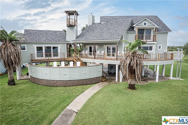 back of house with a patio and a yard